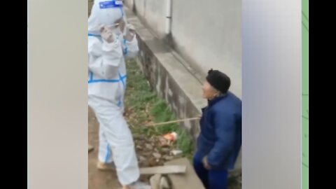 Elderly Chinese Woman Whacks Covid Enforcer With Stick