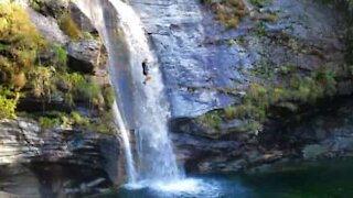 Man takes the plunge in awesome waterfall drop