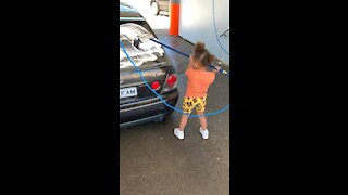 Daughter knows how to wash a car