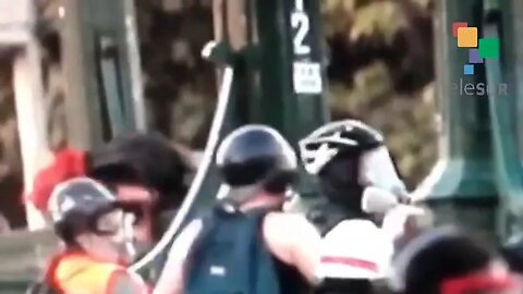 Police take the law into their own hands....throw teenage protester over bridge in Chile