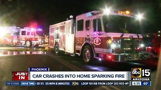 Car crashes into home sparking fire
