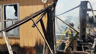 Rural Metro firefighters battle mobile home fire