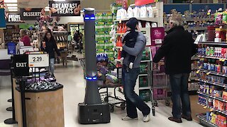 Customers suspicious of high tech security robot patrolling New York supermarket