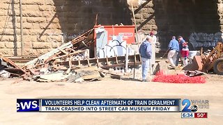 Volunteers Help Clean Aftermath of Train Derailment