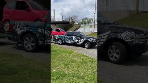 Futura Trailer with two cars and one in the bed.