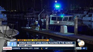 Woman found floating in harbor rescued