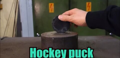 Crushing hockey puck with hydraulic press