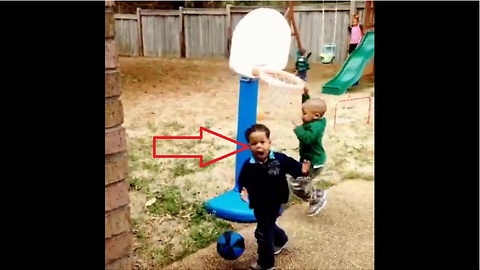 Little boy bewildered by cousin's slam dunk
