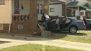 A car drove into the porch of a home on West 134th Street and San Diego Avenue Monday afternoon; two people who ran from the vehicle are both in police custody.