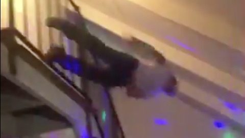 Bills Fan Jumps FACE FIRST into a Table from the Second Floor!