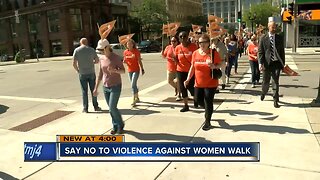 A silent walk to end domestic violence took to the streets of Milwaukee today