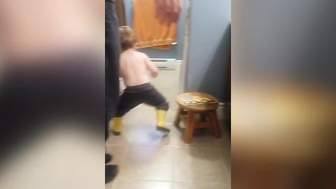 Little Boy Walks With His Legs Wide Apart Because He Peed His Pants