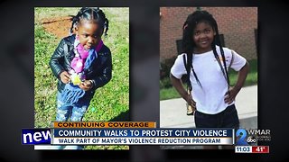 Community walks to rally against violence