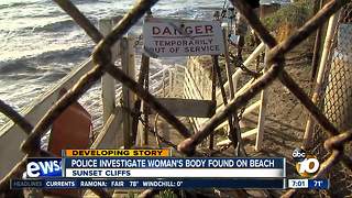 Police investigate woman's body found on beach