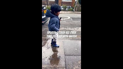 Kid playing in little water pool