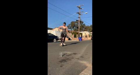 WOW Woman shoots ball into plastic cup