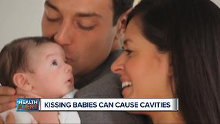 Kissing babies can cause cavities