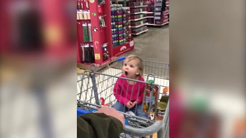 "A Tot Girl Gets Very Excited When She Sees Something in A Store"
