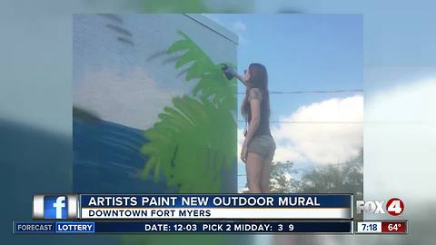 Artists paint new outdoor mural
