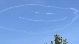 Plane draws giant smiley face in the sky during lockdown