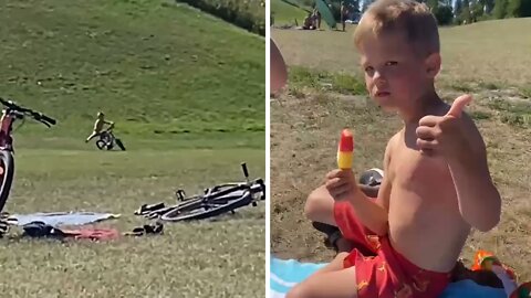 Fearless kid rides bike down hill, totally wipes out