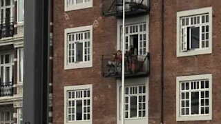 Man plays trumpet for neighbors during quarantine