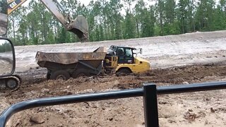 Dump Truck and an Excavator. Just needed a little shove.