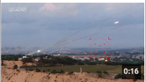 A Palestinian calmly flying a paraglider below the salvo of a working MLRS