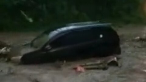 car carried away by flash flood