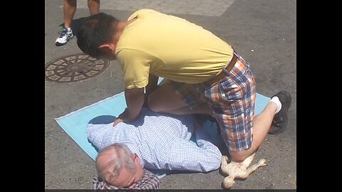 Luodong Massages Elderly White Man On Sidewalk