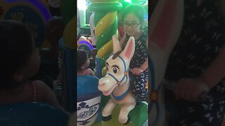 Cute babies have a good time on the merry-go round- Philippines 2017