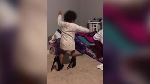 Funny Tot Girl Tries To Walk In Large Heels