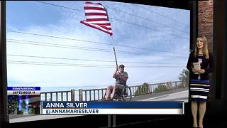 Man drapes flag over Cloverdale overpass