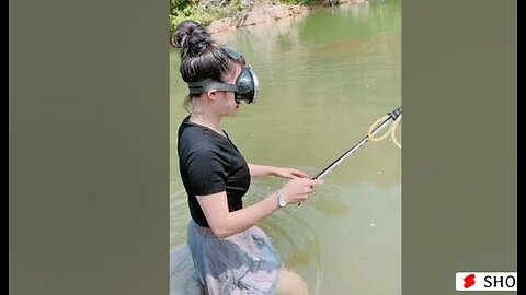 Asian girl spear fishing