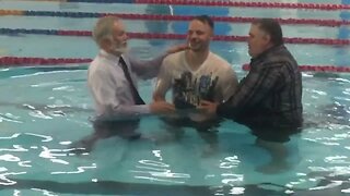 People getting baptised to the glory of God
