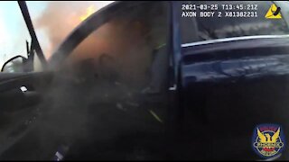 Officers Rescue Unresponsive Driver From Burning Car