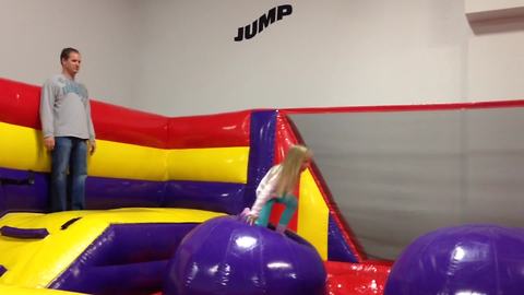 Hilarious Dad Fails Gloriously At Bouncy Obstacle Course