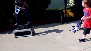 Cheeky Kid Upstages Juggler During Street Performance