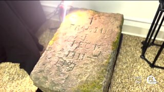 Research continues on headstone from 1781 found on Cuyahoga River near Cuyahoga Falls