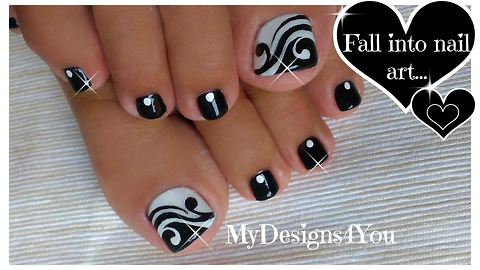 Hand painted black and white toenail art design