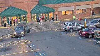 Surveillance cam catches moment woman crashes her vehicle into two men at Kroger