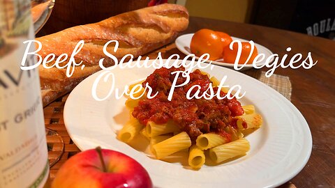 Beef, Sausage, Crushed Tomatoes & Vegetables over Pasta