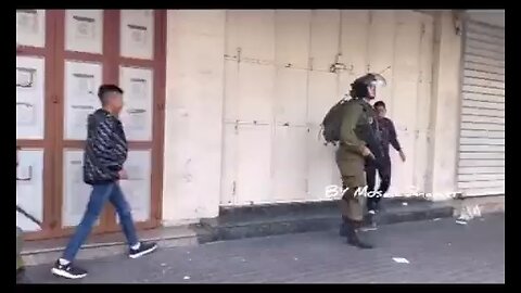 lsraeli Apartheid occupation forces detain 2 Palestinian children walking to the doctor in Hebron.