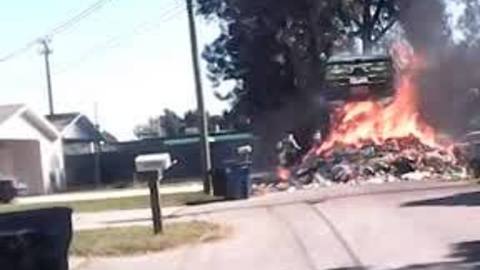 Truck catches fire, dumps debris on parked cars
