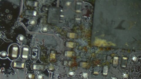 Dead Macbook Pro from feces like substance on current sensing circuit