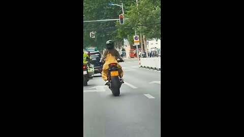 Girl on heavy bike