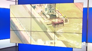 Crews to remove shipping containers from the Ever Forward in order to get it floating again