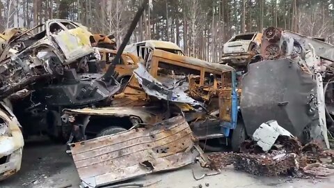 Cleanup in Inprin - Mounds of Wrecked Cars