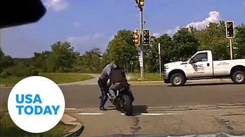 Motorcyclist runs Massachusetts state trooper into oncoming traffic | USA TODAY