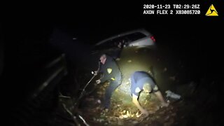 Caught on camera: Alliance officers rescue woman from a submerged car after she drove into river